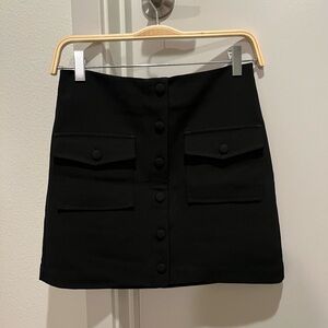 Black mini skirt with pockets